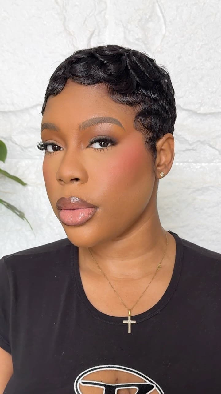 Close-up of a soft, clean beat: defined brows, sculpted cheeks and a glossy nude lip